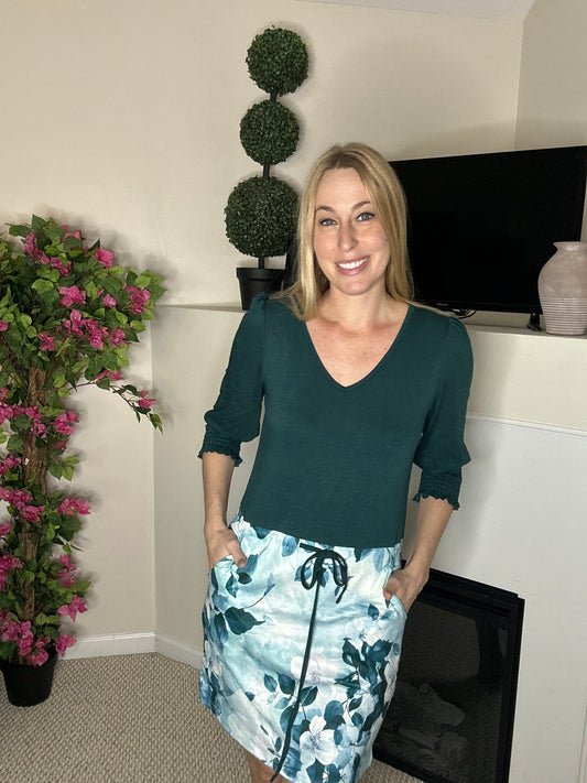 Teal mini dress with floral design