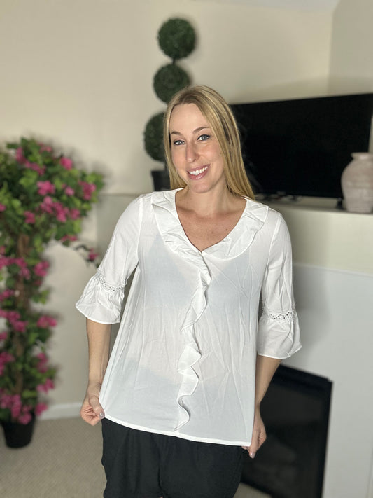 Off white ruffle blouse