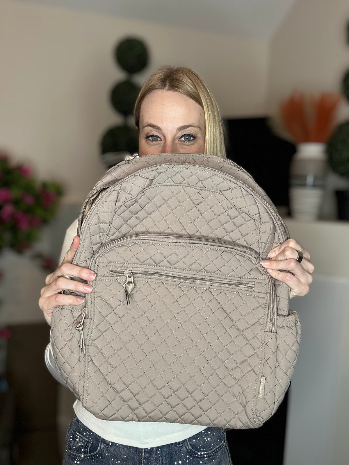 Beige quilted backpack