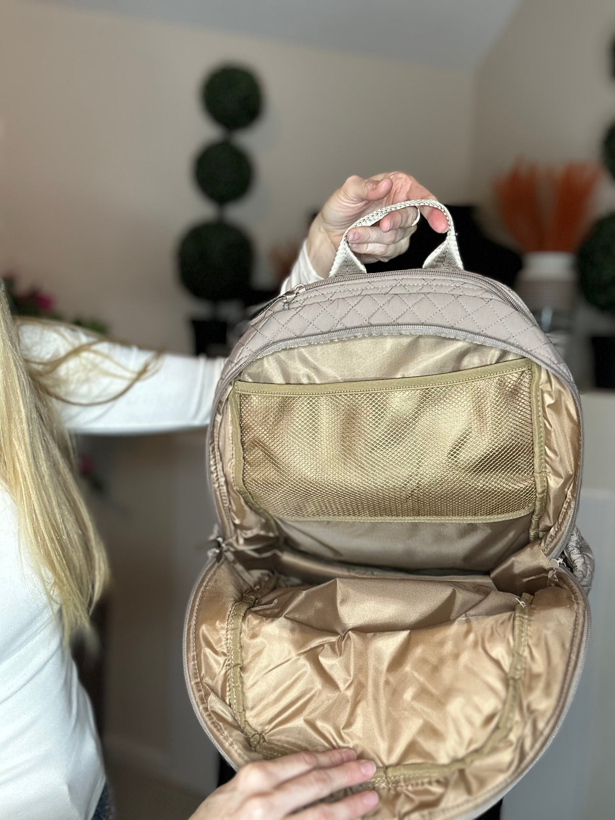 Beige quilted backpack
