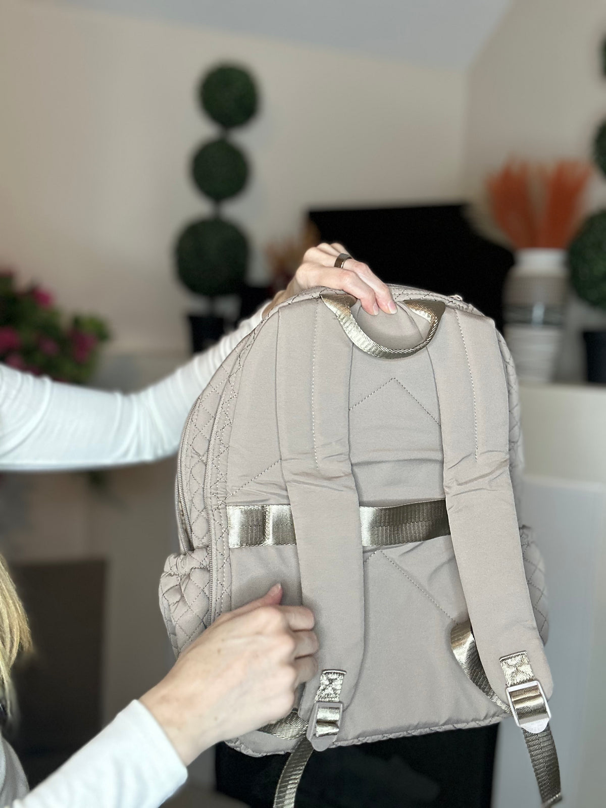 Beige quilted backpack