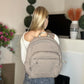 Beige quilted backpack