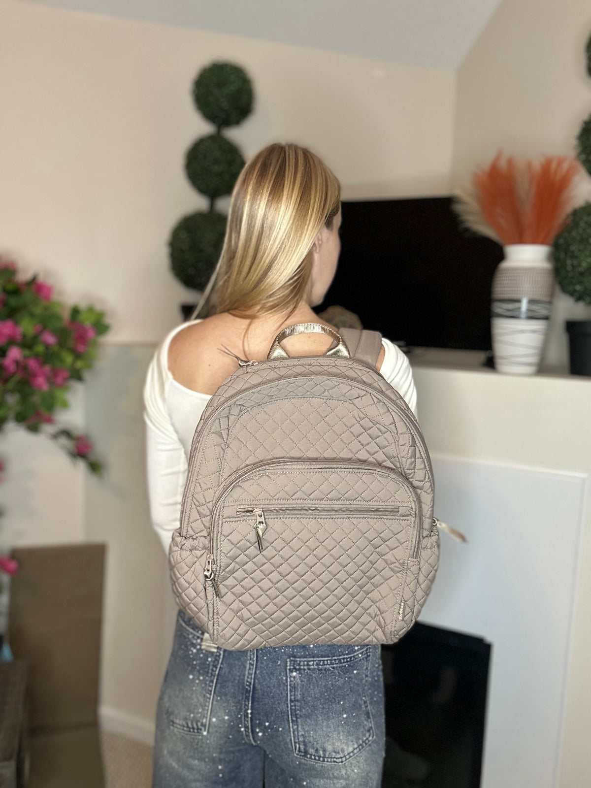 Beige quilted backpack