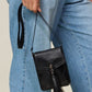 Zenana PU Leather Tassel Hollowed Crossbody Bag